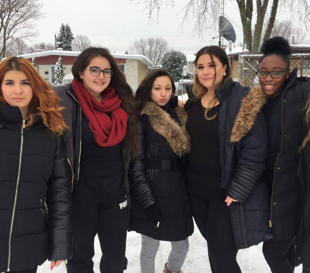 students standing outside smiling 