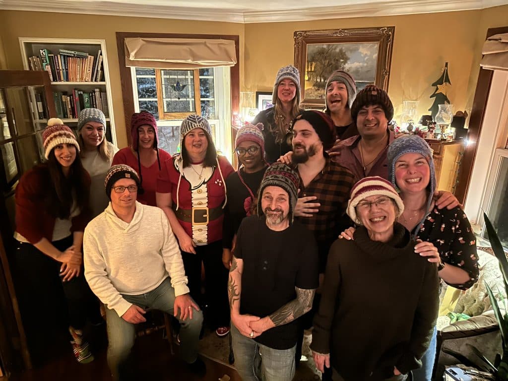 Staff at Christmas party with knitted hats